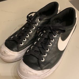 Nike black leather sneakers.